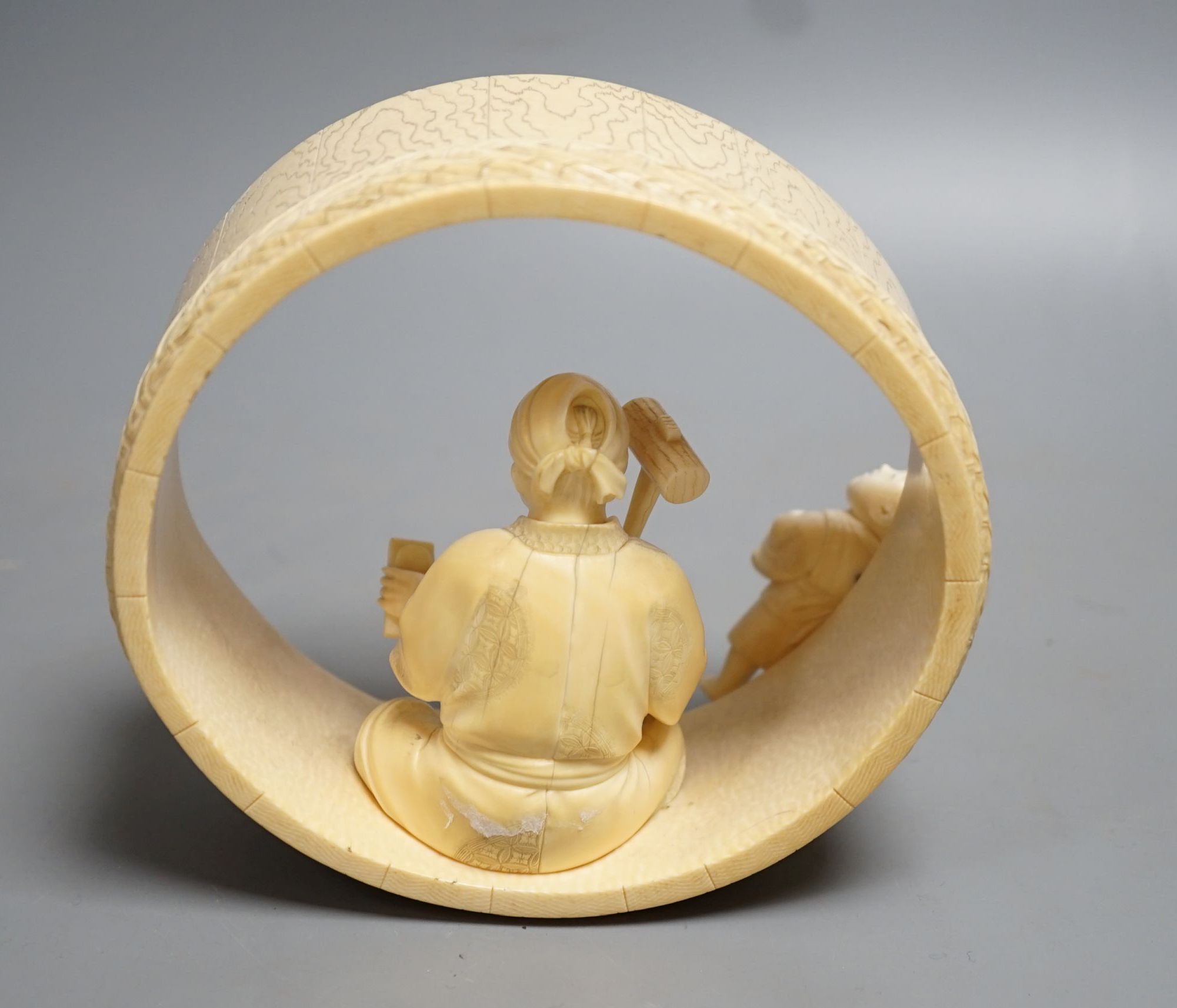 A Japanese ivory okimono of carpenter and child, Meiji period 15cm